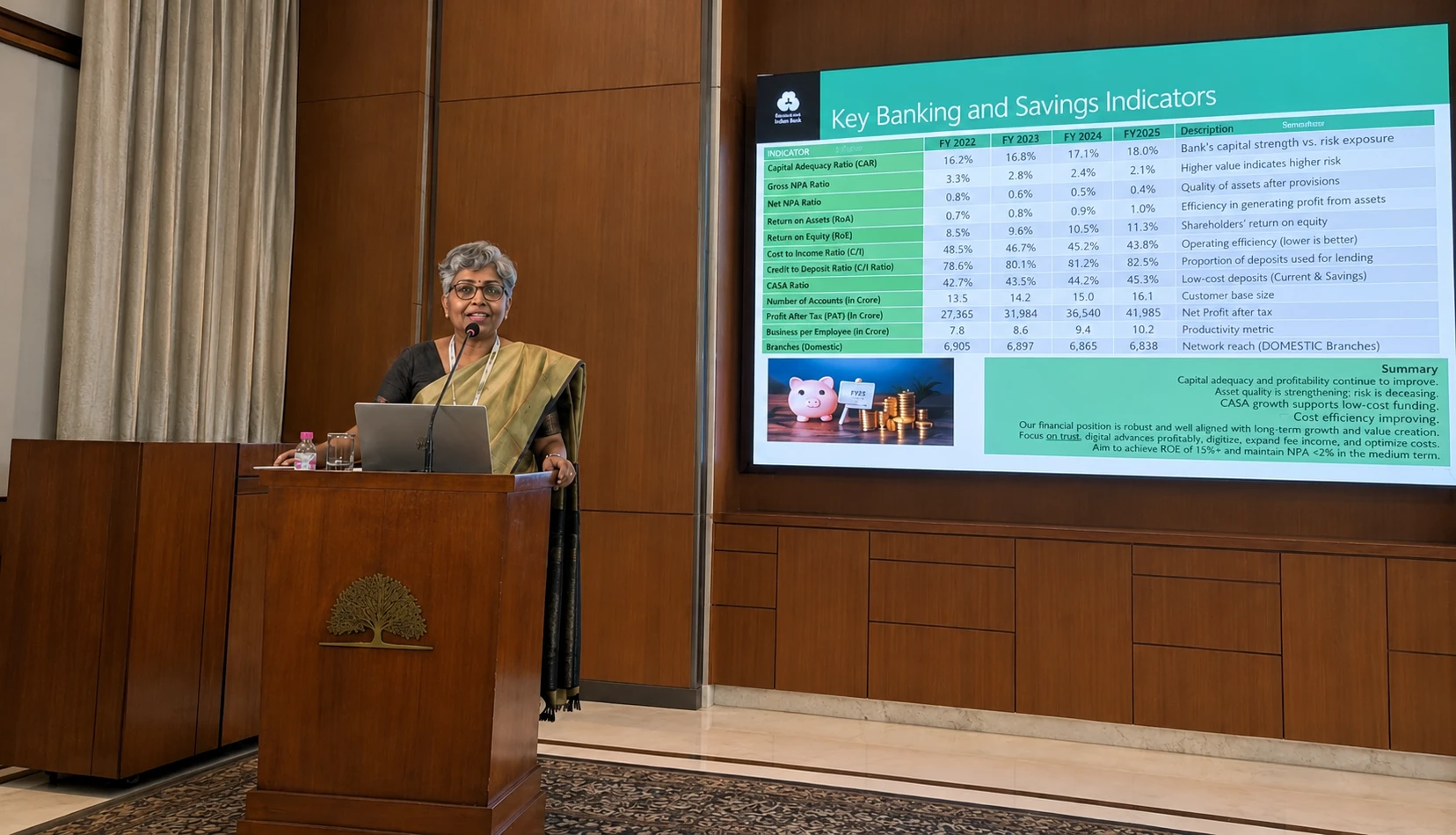 A speaker presenting key banking and savings indicators at a conference